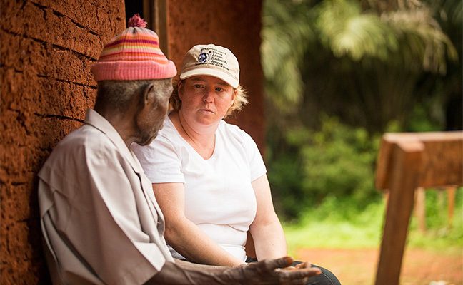 Professor Hilary Godwin speaks with a community elder in Cameroon.
