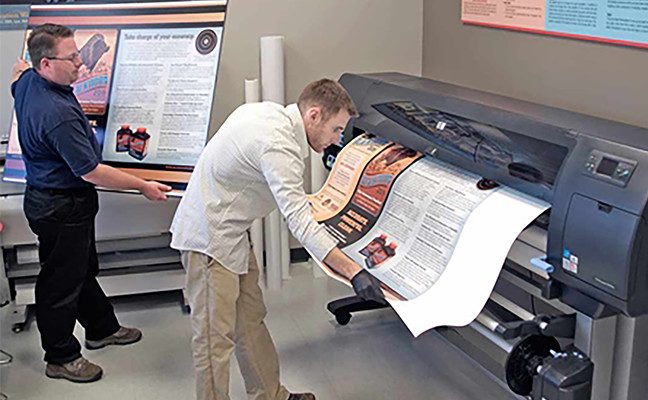 Students can print research posters on large-format printers provided by the library.