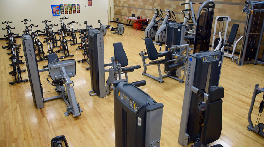 Indoor gym filled with exercise equipment.