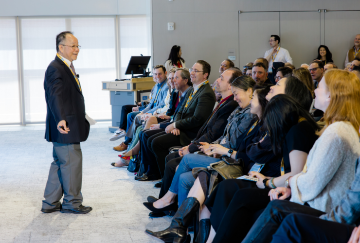 UCLA Anderson professor presenting and speaking at an academic event.