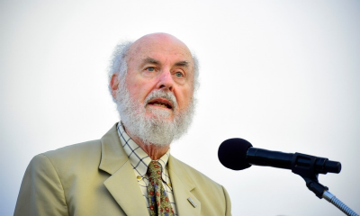 Donald Shoup speaking in front of a microphone.